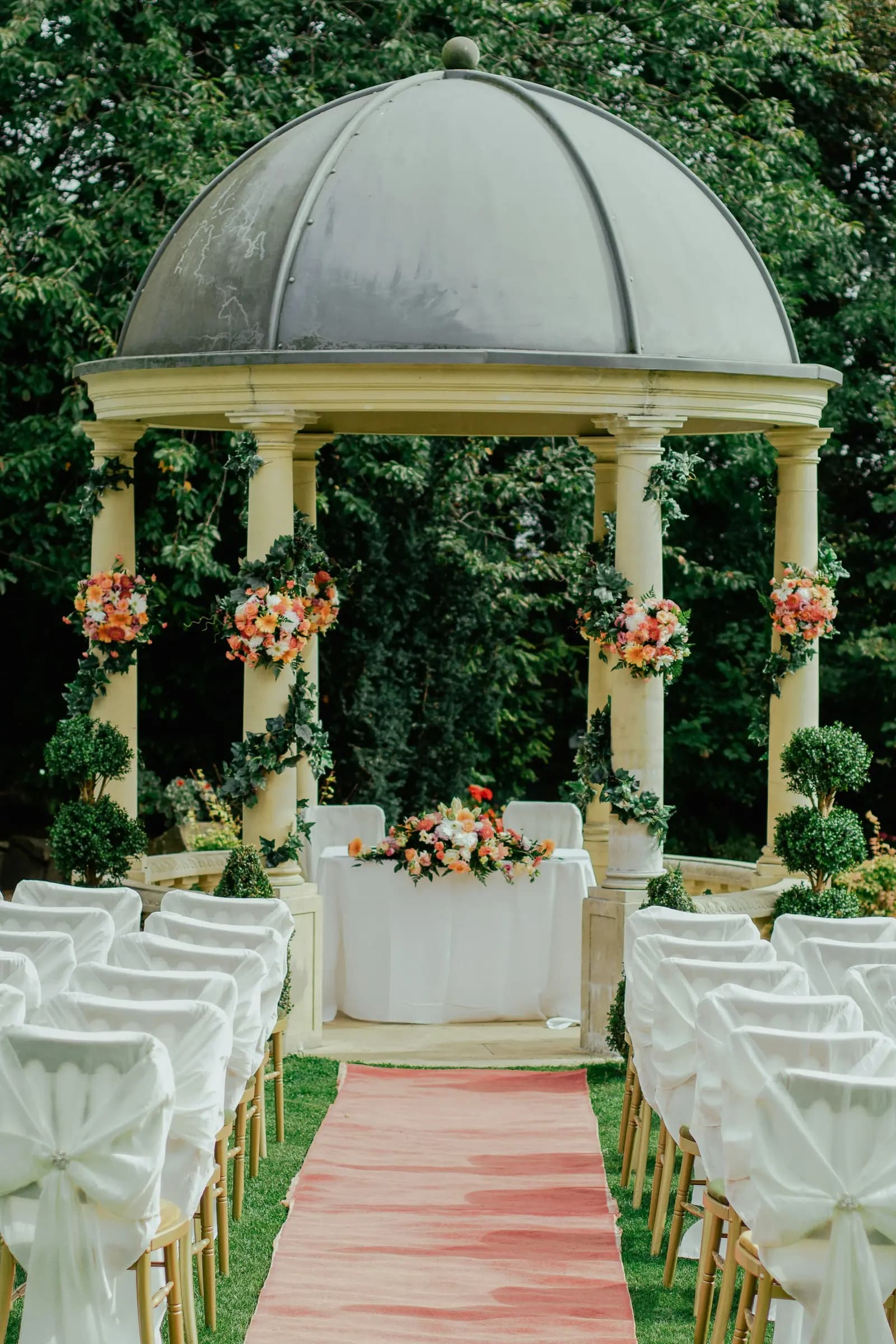 Garden gazebo dressed in flowers for a ceremony